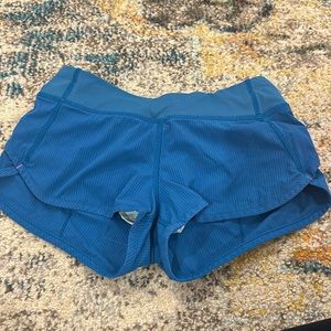 blue and hot pink ivivva shorts